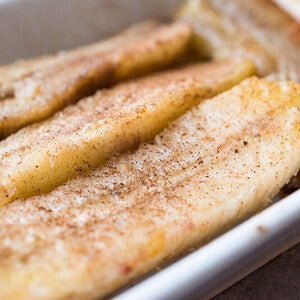 Caramelized banana slices in a white dish.